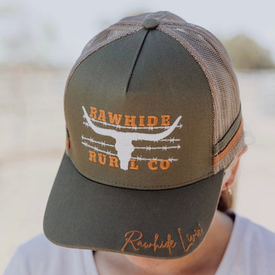 Trucker hat with 'Rawhide Rural Co' branding on a blurred background