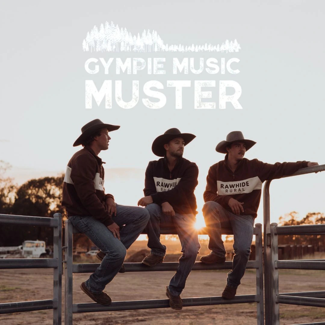 Three men in cowboy hats sitting on a fence with 'GYMPIE MUSIC MUSTER' text overlay.